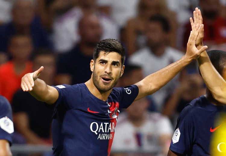 Paris Saint-Germain's Marco Asensio aims to score against Borussia Dortmund in the Champions League